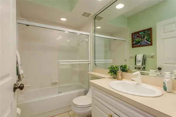 a view of a swimming pool with outdoor seating and city view