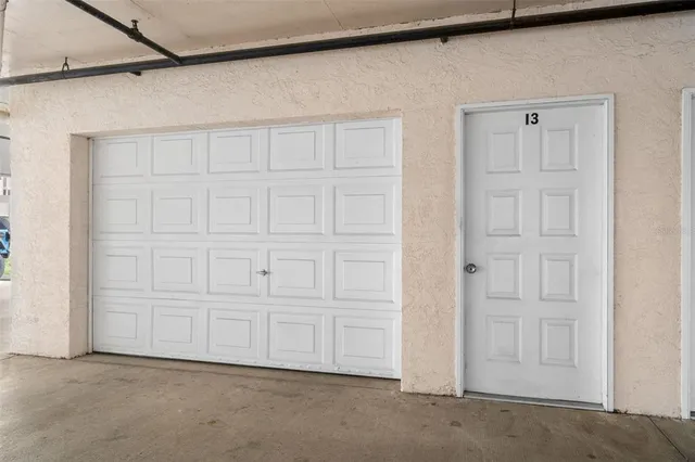a view of a swimming pool with outdoor seating and city view