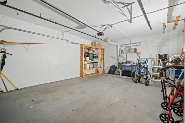 an aerial view of residential houses with outdoor space and river