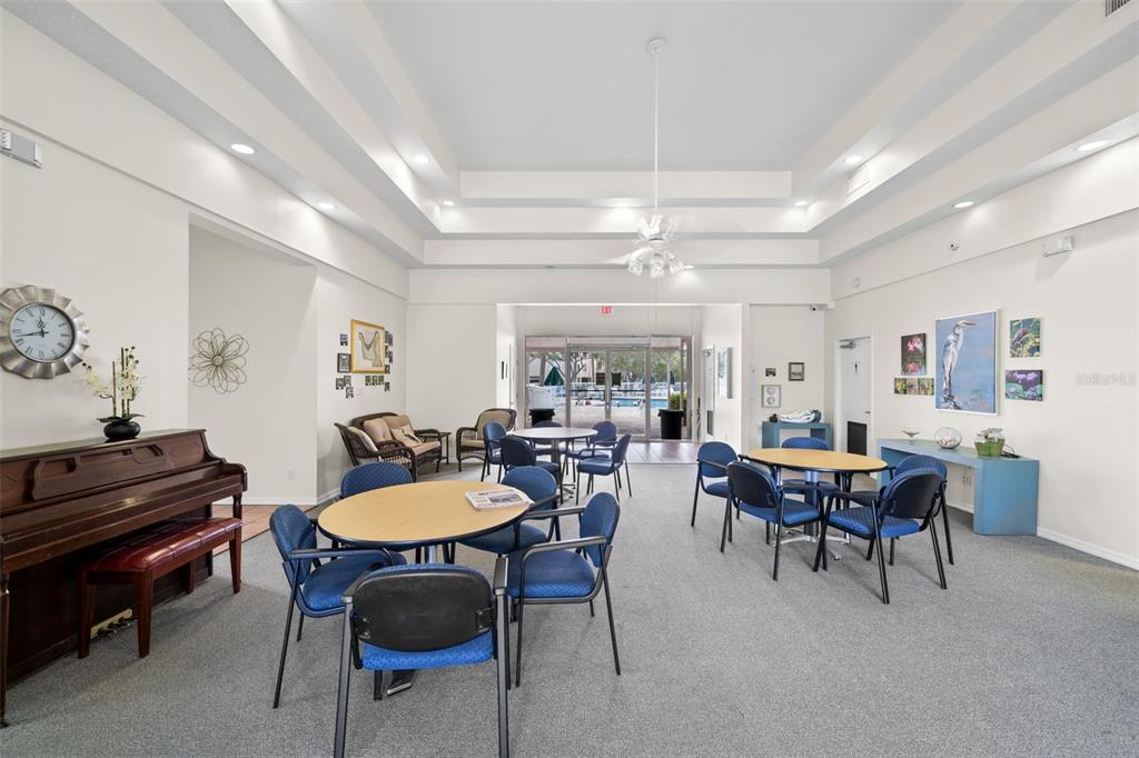 6475 Shoreline Drive, Unit 5403 St. Petersburg, FL 33708 - Photo 35 of 46 a view of a dining room with furniture