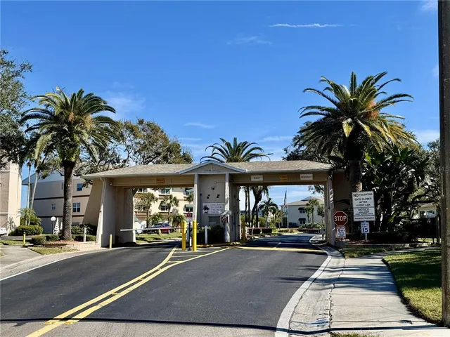 a view of swimming pool with outdoor seating and plants