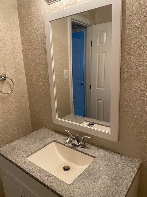 3206 Lobit Drive, Unit 42 Dickinson, TX 77539 - Photo 12 of 19 a bathroom with a sink and a mirror