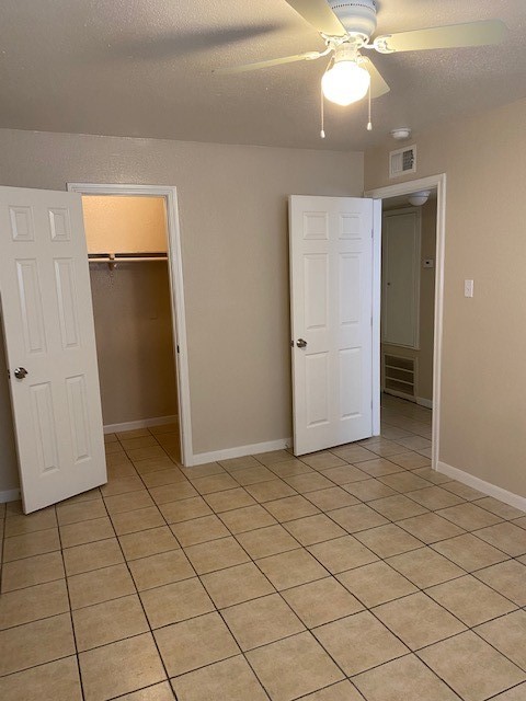3206 Lobit Drive, Unit 42 Dickinson, TX 77539 - Photo 18 of 19 an empty room with closet and chandelier fan
