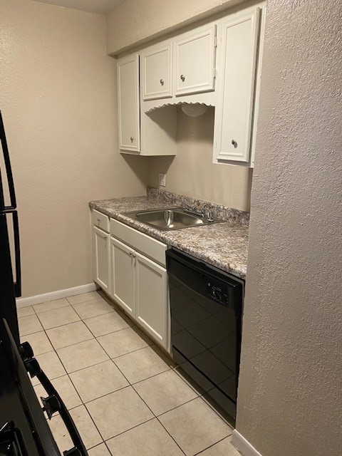 3206 Lobit Drive, Unit 42 Dickinson, TX 77539 - Photo 2 of 19 a kitchen with granite countertop a stove a sink and a microwave