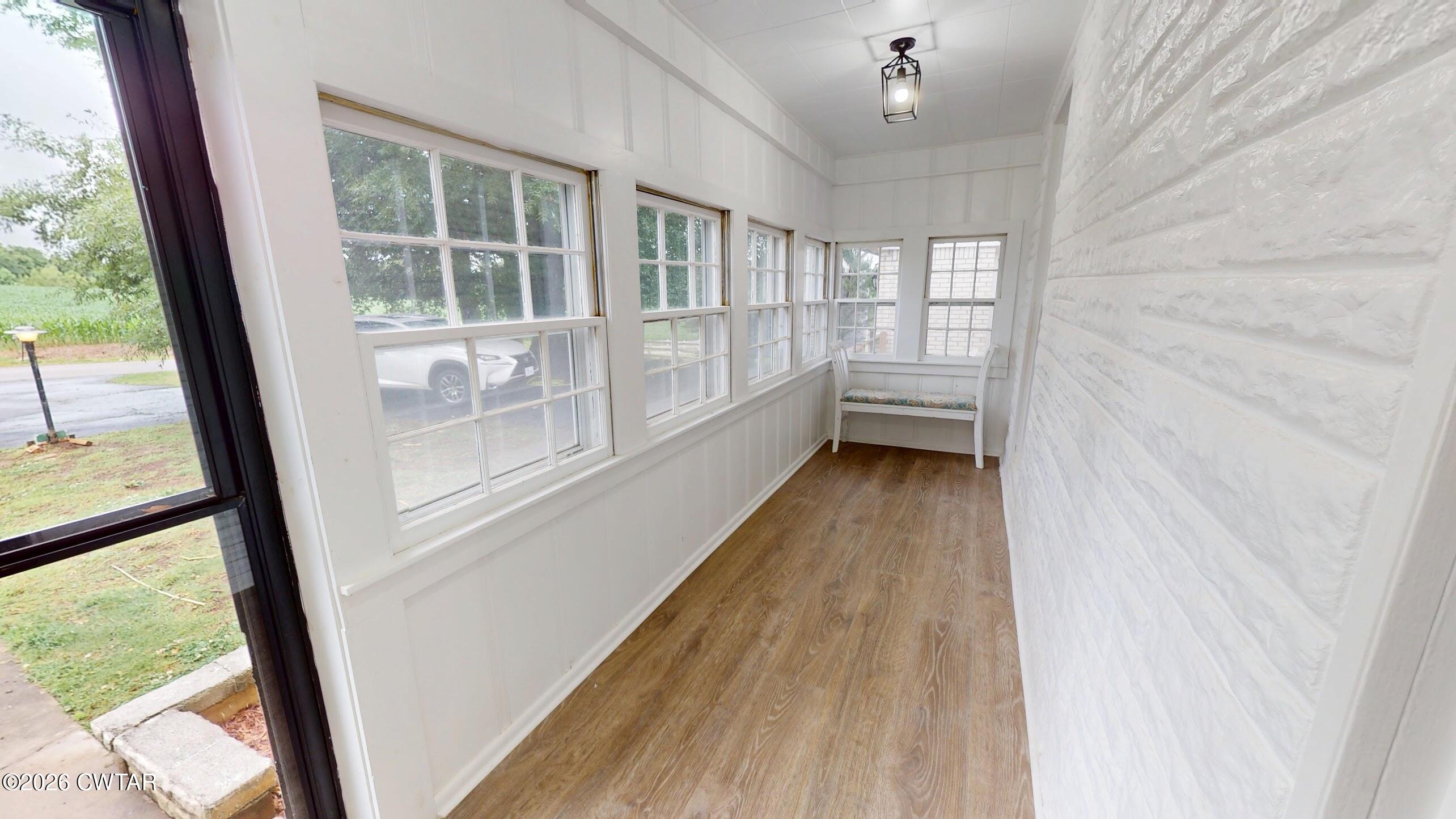 2800 Locust Grove Road Newbern, TN 38059 - Photo 4 of 46 a view of a room with wooden floor and windows