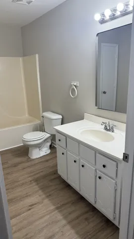 a kitchen with stainless steel appliances granite countertop a sink and a stove
