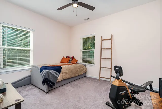 a bed room with a bed and a window