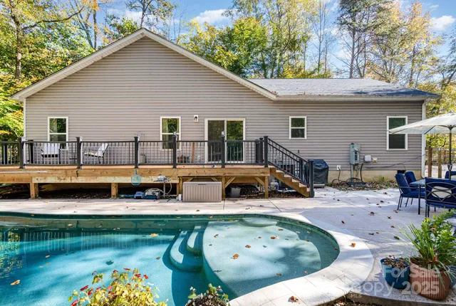 a house view with a seating space and a garden