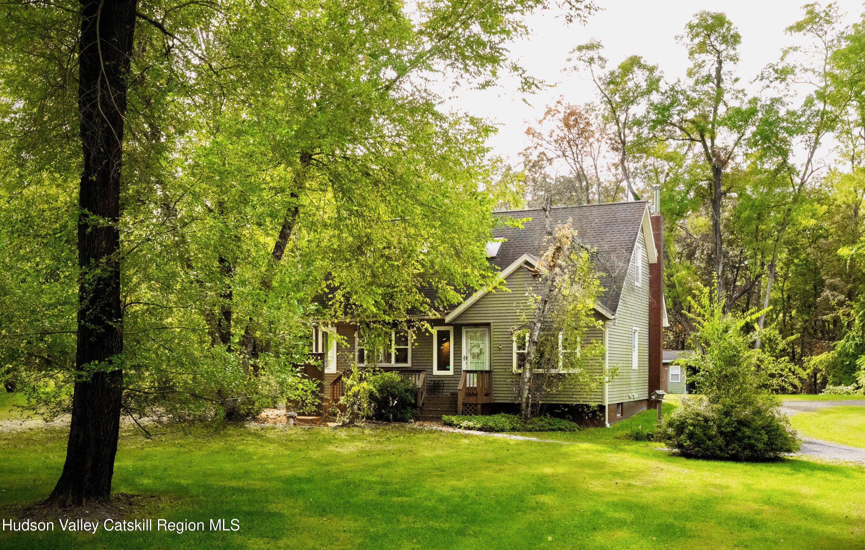 688 Churchland Road Saugerties, NY 12477 - Photo 1 of 37 a view of a big yard with plants and large trees