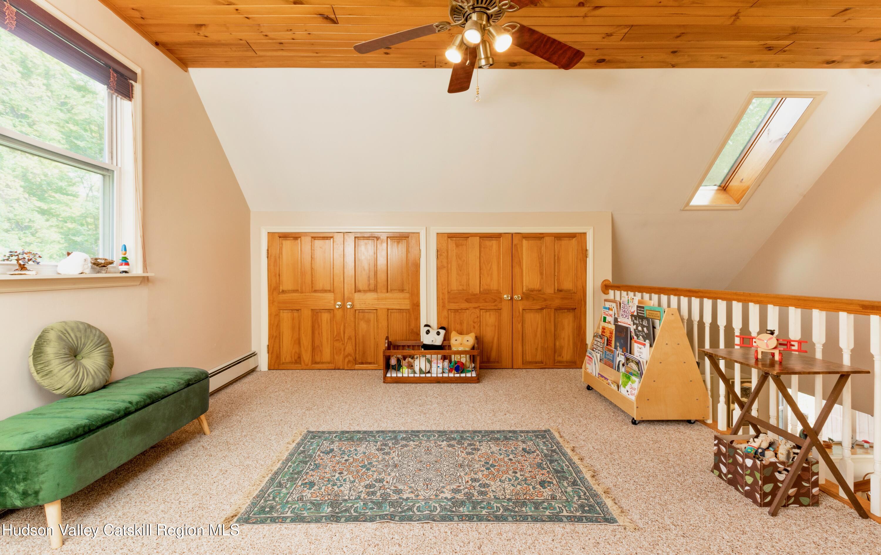 688 Churchland Road Saugerties, NY 12477 - Photo 17 of 37 a living room with furniture and a window