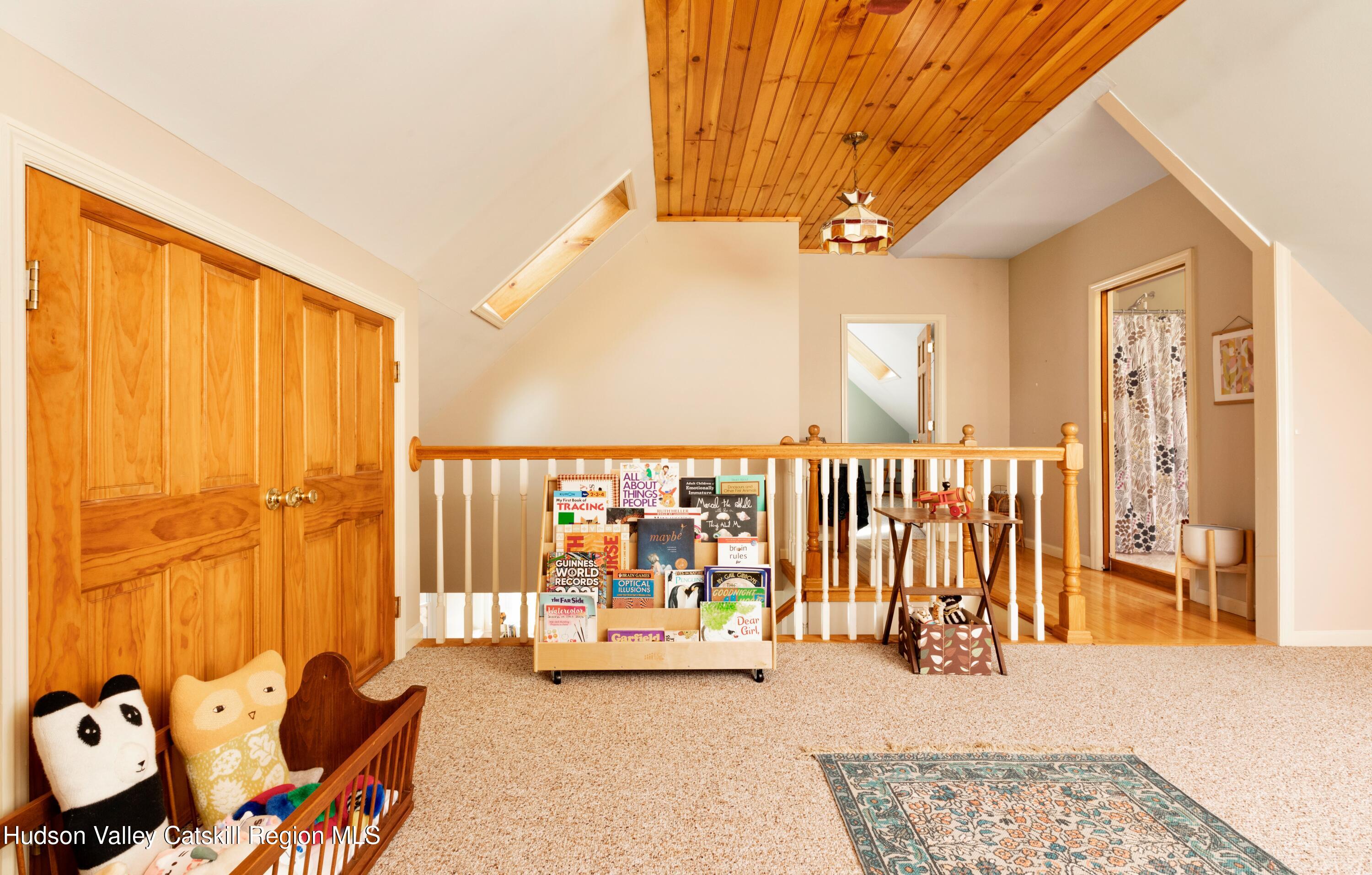 688 Churchland Road Saugerties, NY 12477 - Photo 18 of 37 a view of a balcony with furniture and floor to ceiling window