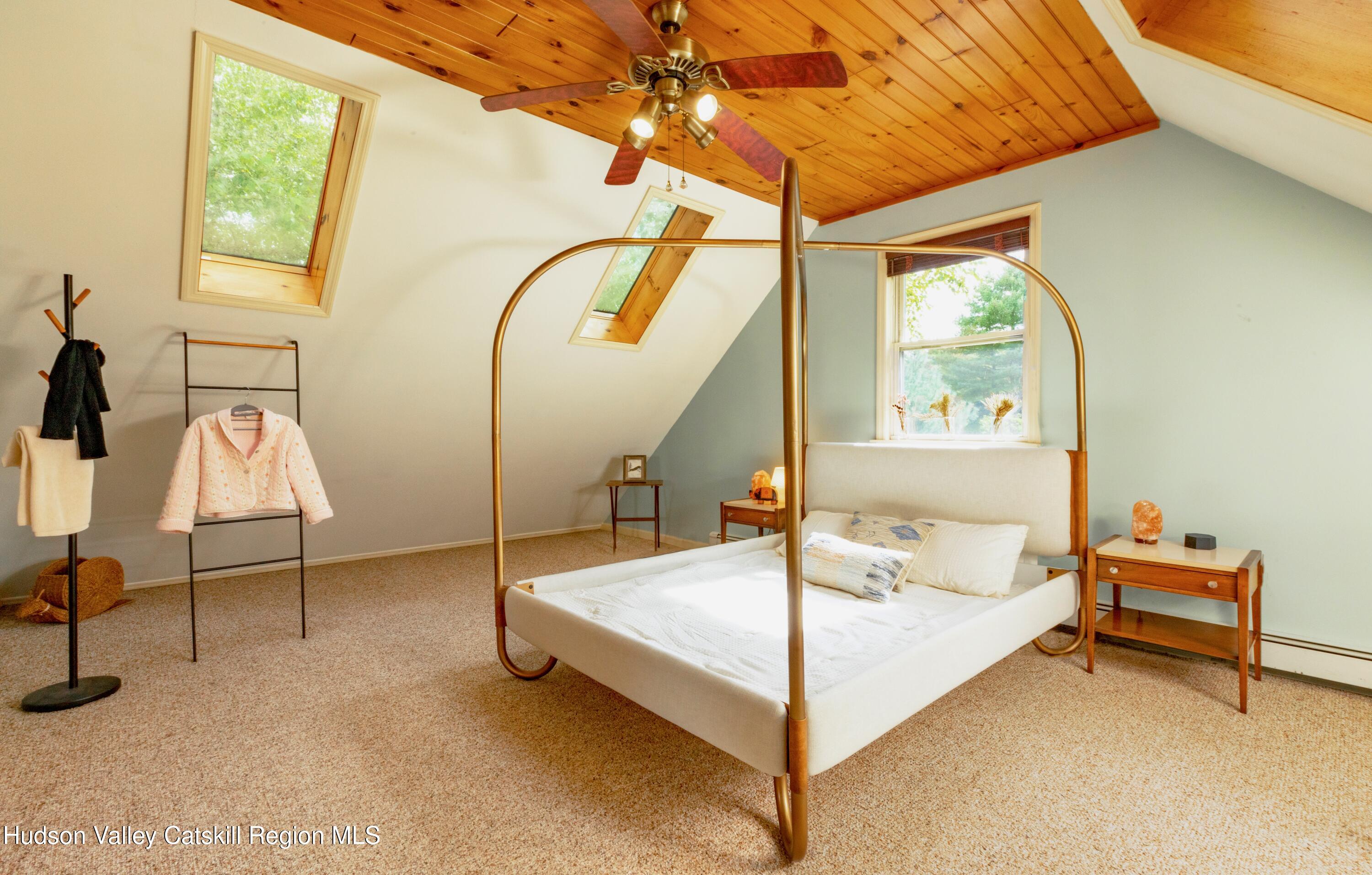 688 Churchland Road Saugerties, NY 12477 - Photo 21 of 37 a bed room with a bed and a window