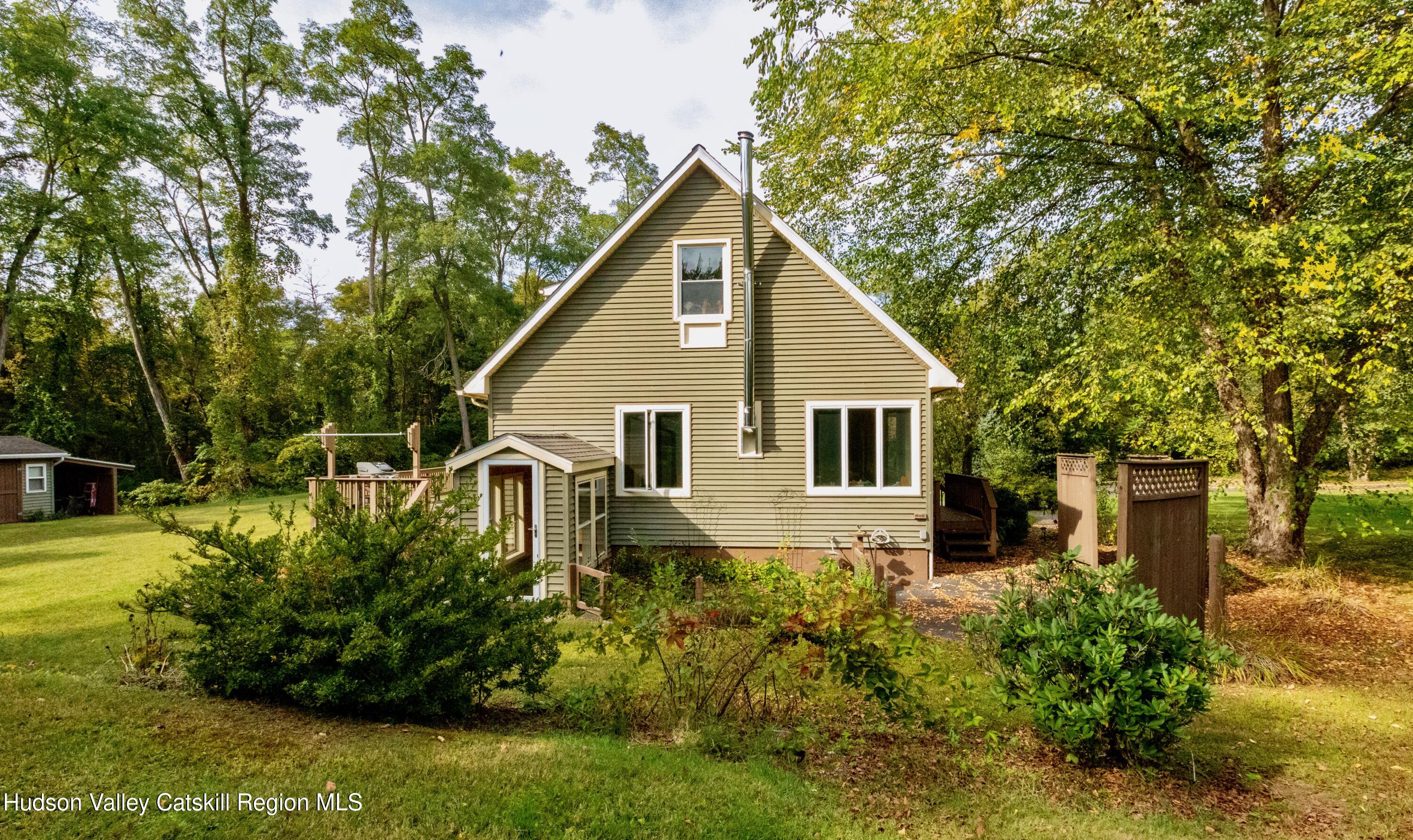 688 Churchland Road Saugerties, NY 12477 - Photo 29 of 37 a view of a house with backyard and garden