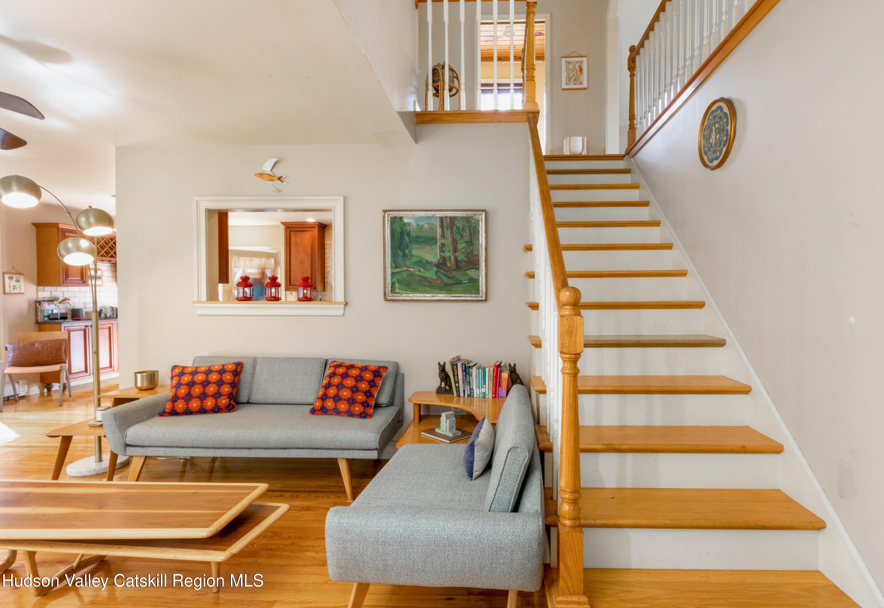 688 Churchland Road Saugerties, NY 12477 - Photo 3 of 37 a living room with furniture and a white wall with wooden floor