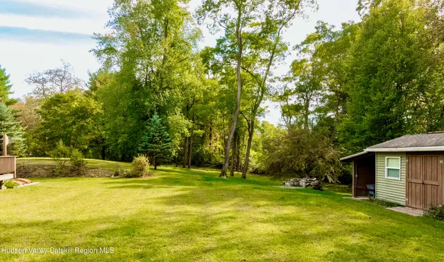 a view of a backyard with cabin