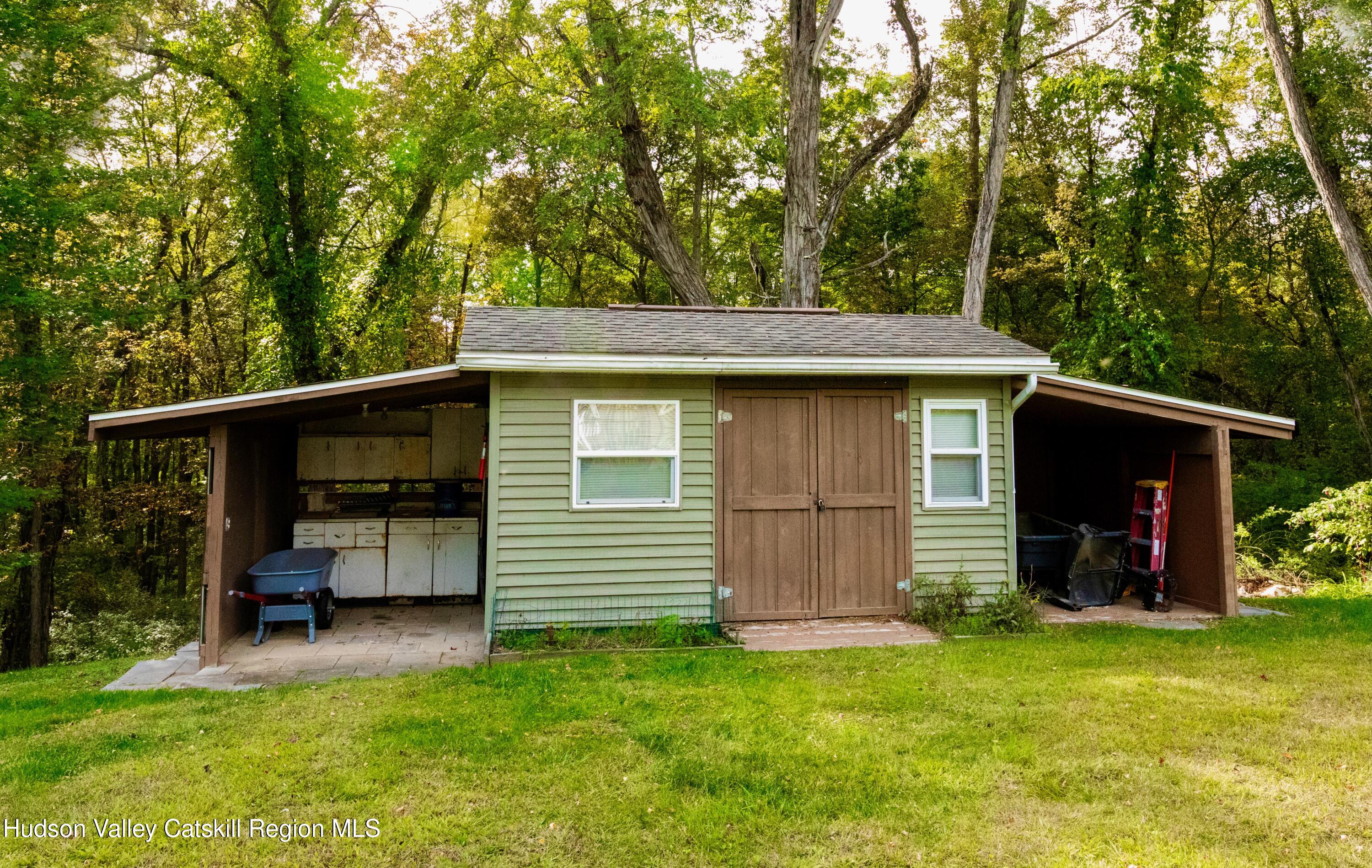 688 Churchland Road Saugerties, NY 12477 - Photo 32 of 37 a view of a backyard with cabin