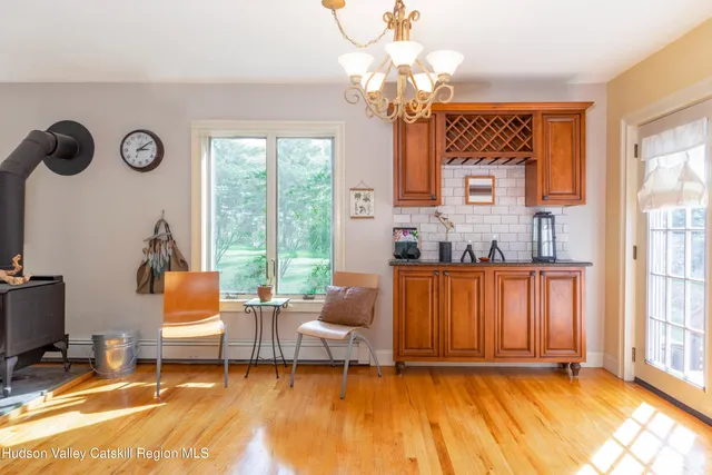 a living room with patio furniture and a window
