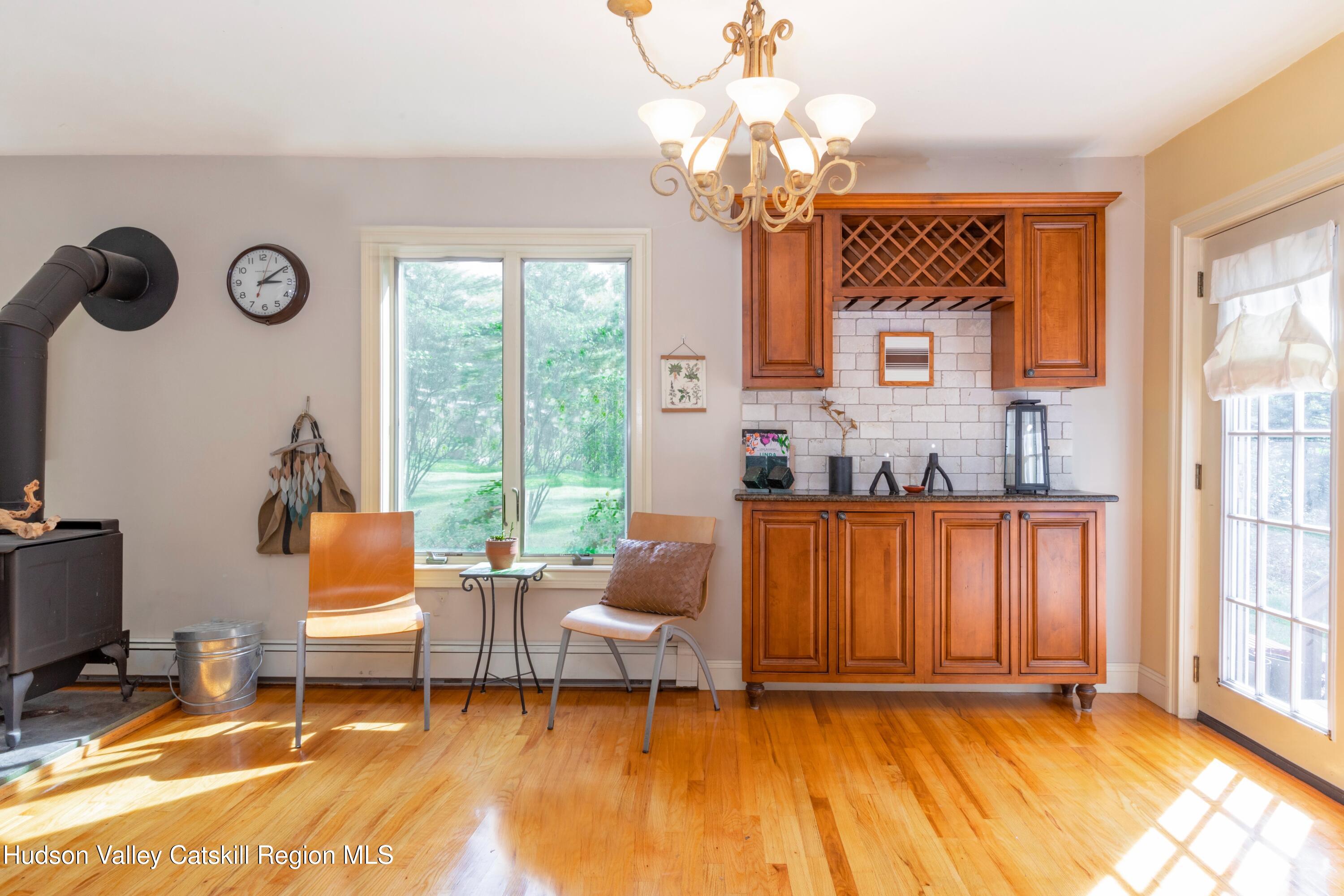 688 Churchland Road Saugerties, NY 12477 - Photo 7 of 37 a living room with patio furniture and a window
