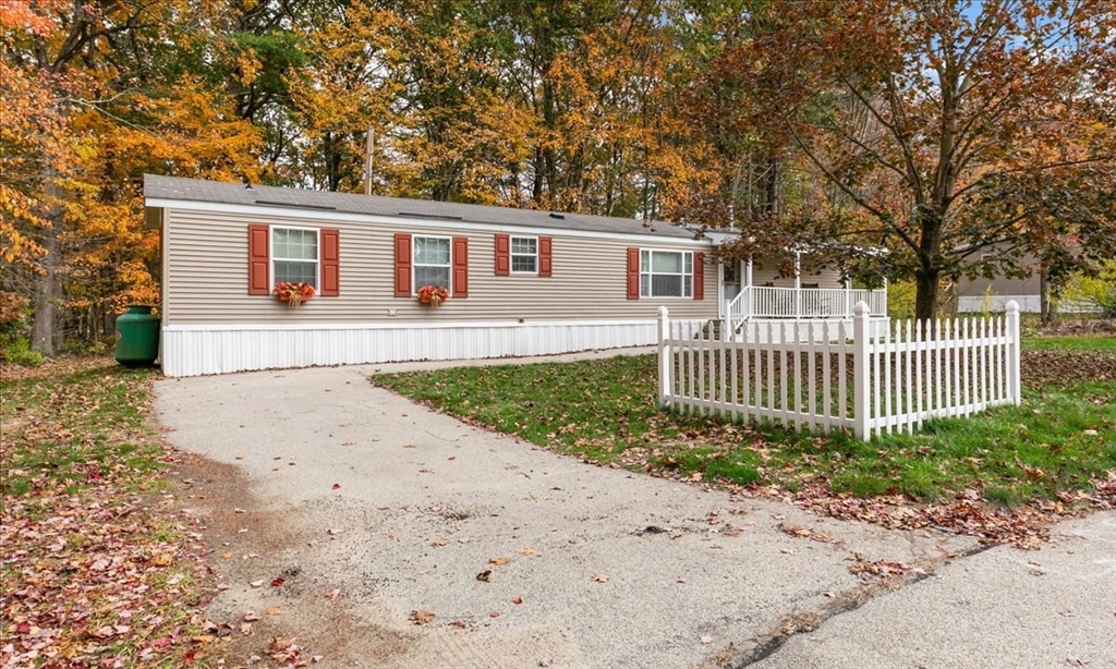 38 Rosemary Street Salem, NH 03079 - Photo 2 of 36 a front view of a house with a garden