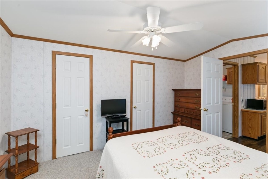 38 Rosemary Street Salem, NH 03079 - Photo 21 of 36 a bedroom with a bed and a flat screen tv