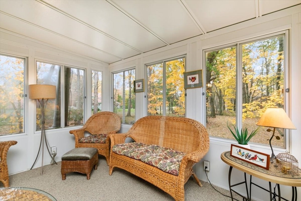 38 Rosemary Street Salem, NH 03079 - Photo 26 of 36 a living room with furniture and a large window