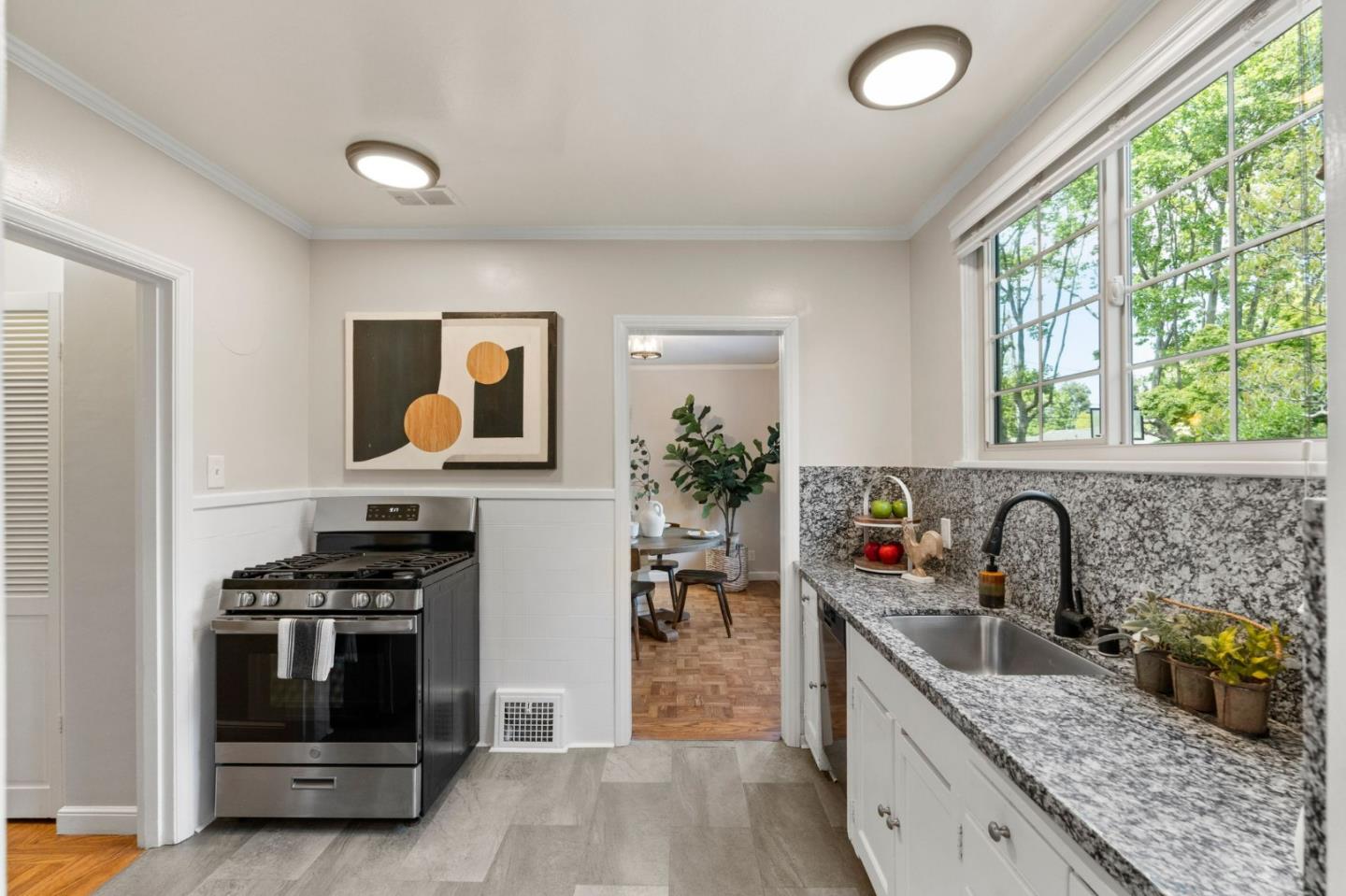 796 Willborough Road Burlingame, CA 94010 - Photo 11 of 31 a kitchen with granite countertop a stove and a sink
