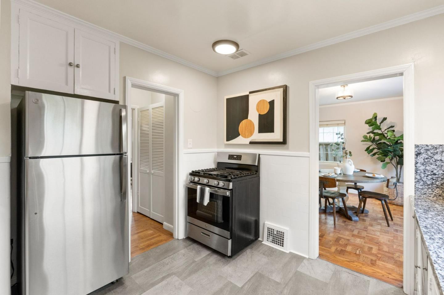796 Willborough Road Burlingame, CA 94010 - Photo 12 of 31 a kitchen with stainless steel appliances granite countertop a refrigerator and a stove