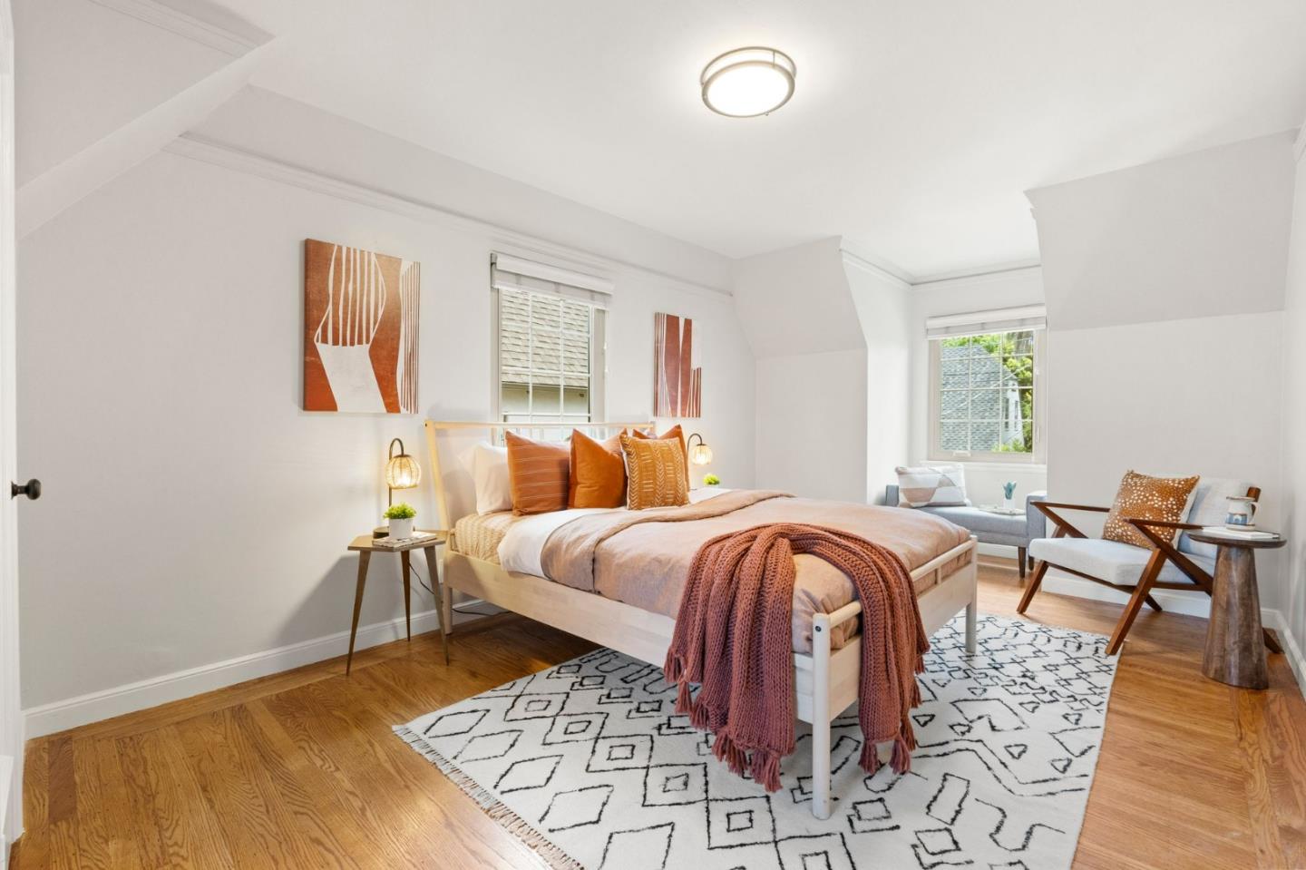 796 Willborough Road Burlingame, CA 94010 - Photo 13 of 31 a bedroom with a bed and wooden floor