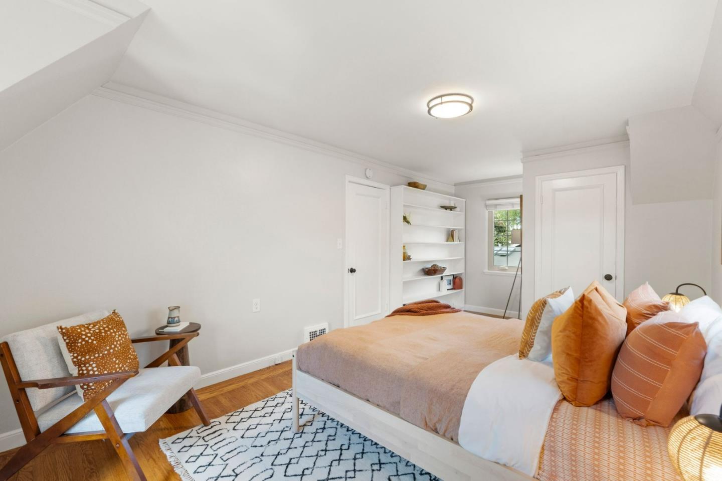 796 Willborough Road Burlingame, CA 94010 - Photo 14 of 31 a bedroom with a bed and chair