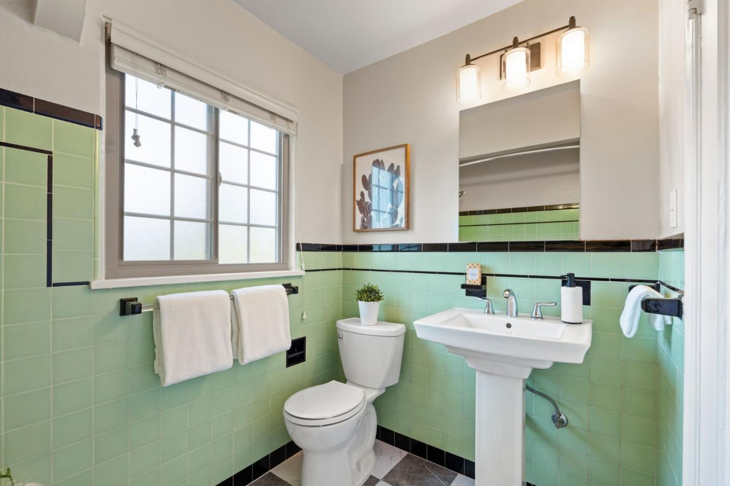796 Willborough Road Burlingame, CA 94010 - Photo 24 of 31 a bathroom with a sink and mirror