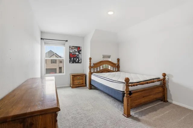 a bedroom with furniture and a window