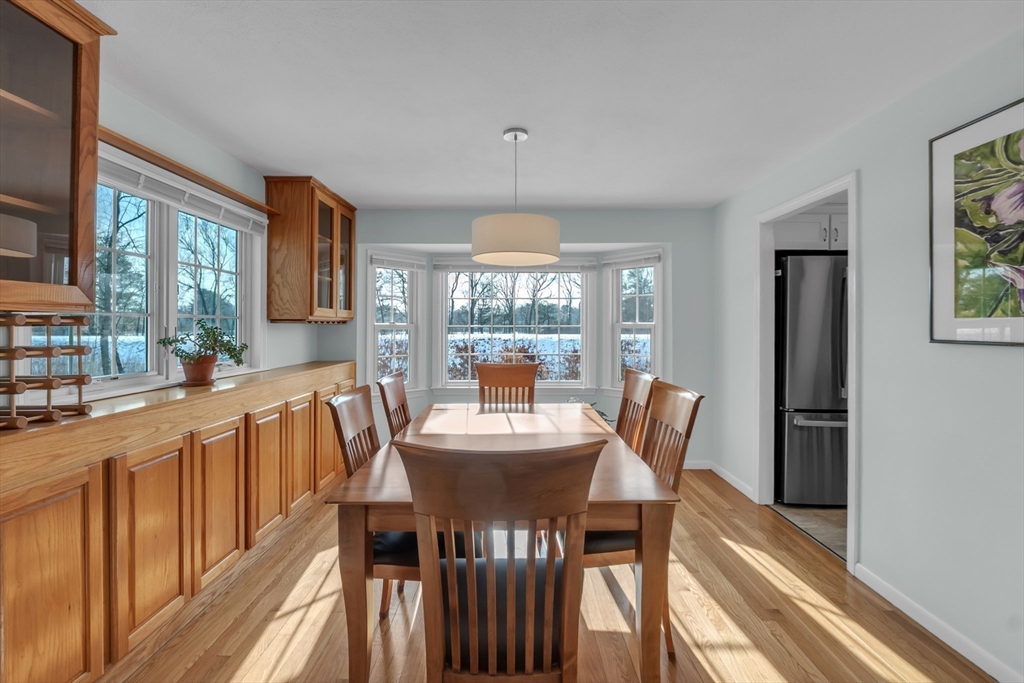 36 Cider Mill Road Framingham, MA 01701 - Photo 16 of 42 a dining room with furniture a chandelier and wooden floor