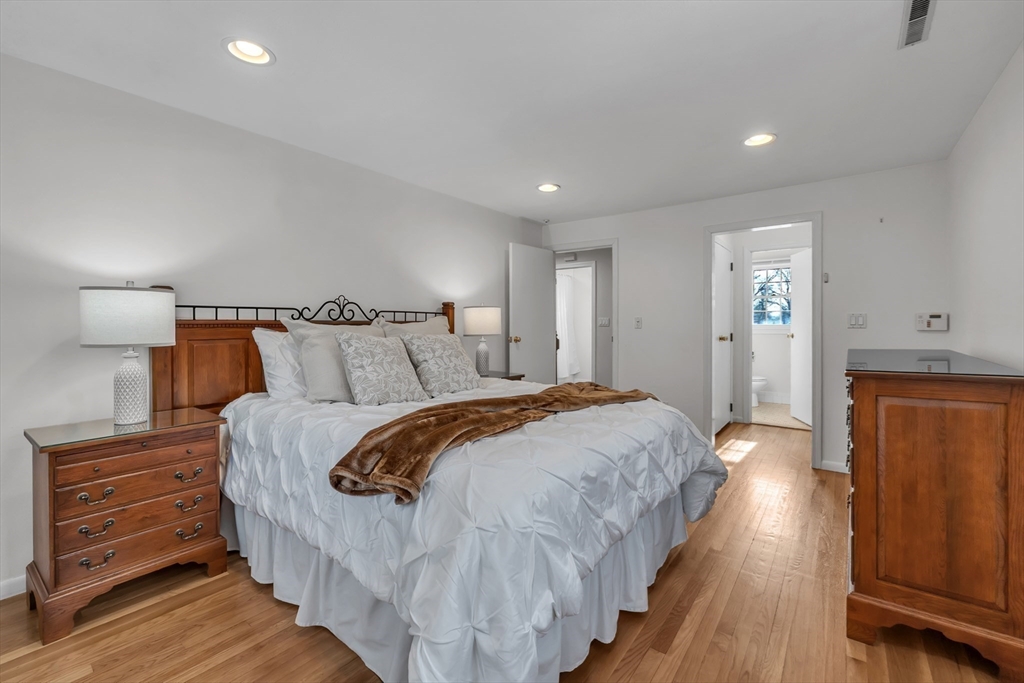 36 Cider Mill Road Framingham, MA 01701 - Photo 22 of 42 a bedroom with bed and wooden floor