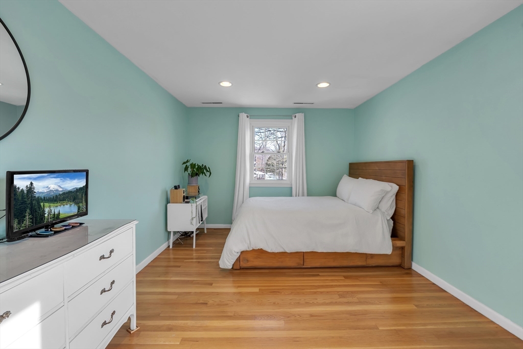 36 Cider Mill Road Framingham, MA 01701 - Photo 24 of 42 a bedroom with a bed and a flat screen tv