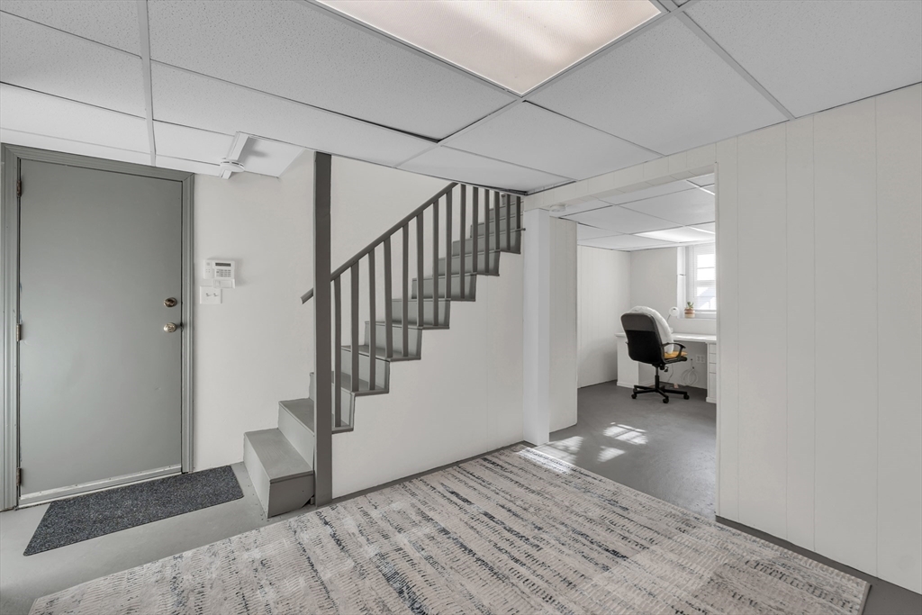 36 Cider Mill Road Framingham, MA 01701 - Photo 27 of 42 a view of a hallway with wooden floor and a livingroom