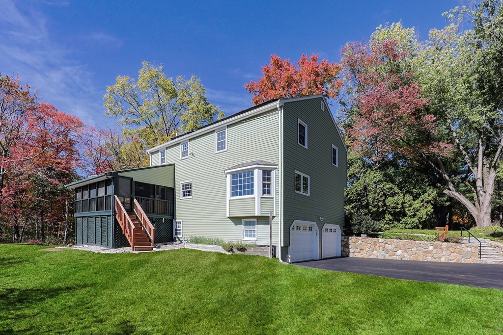 36 Cider Mill Road Framingham, MA 01701 - Photo 7 of 42 a view of a house with backyard and a tree