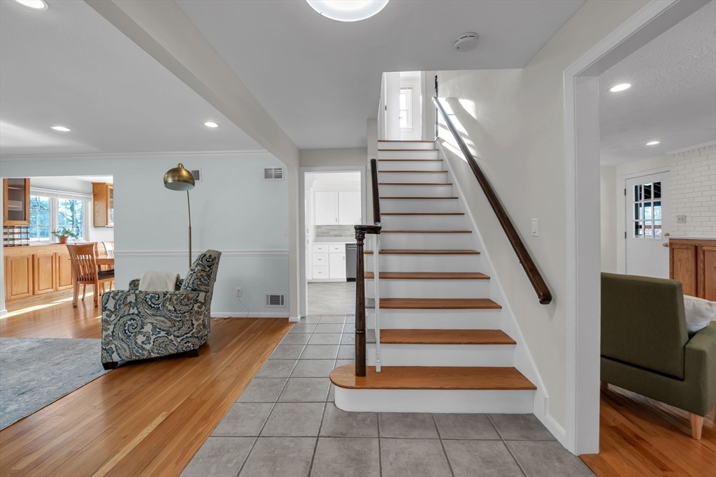 36 Cider Mill Road Framingham, MA 01701 - Photo 8 of 42 a view of entryway and hall with wooden floor