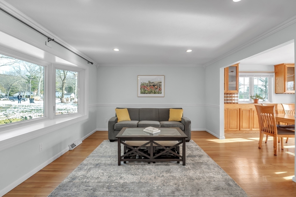 36 Cider Mill Road Framingham, MA 01701 - Photo 10 of 42 a living room with furniture and a table with wooden floor