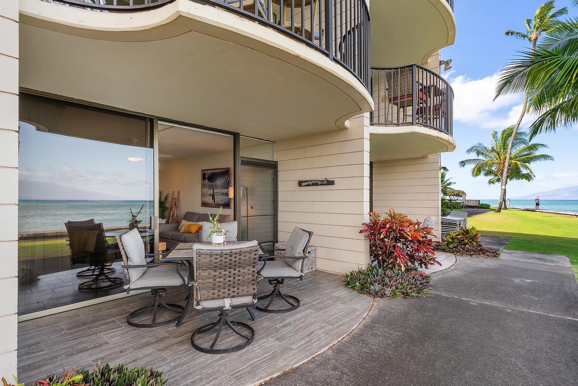 4471 Lower Honoapiilani Road, Unit 118 Lahaina, HI 96761 - Photo 22 of 41 a view of a chairs and table in the patio