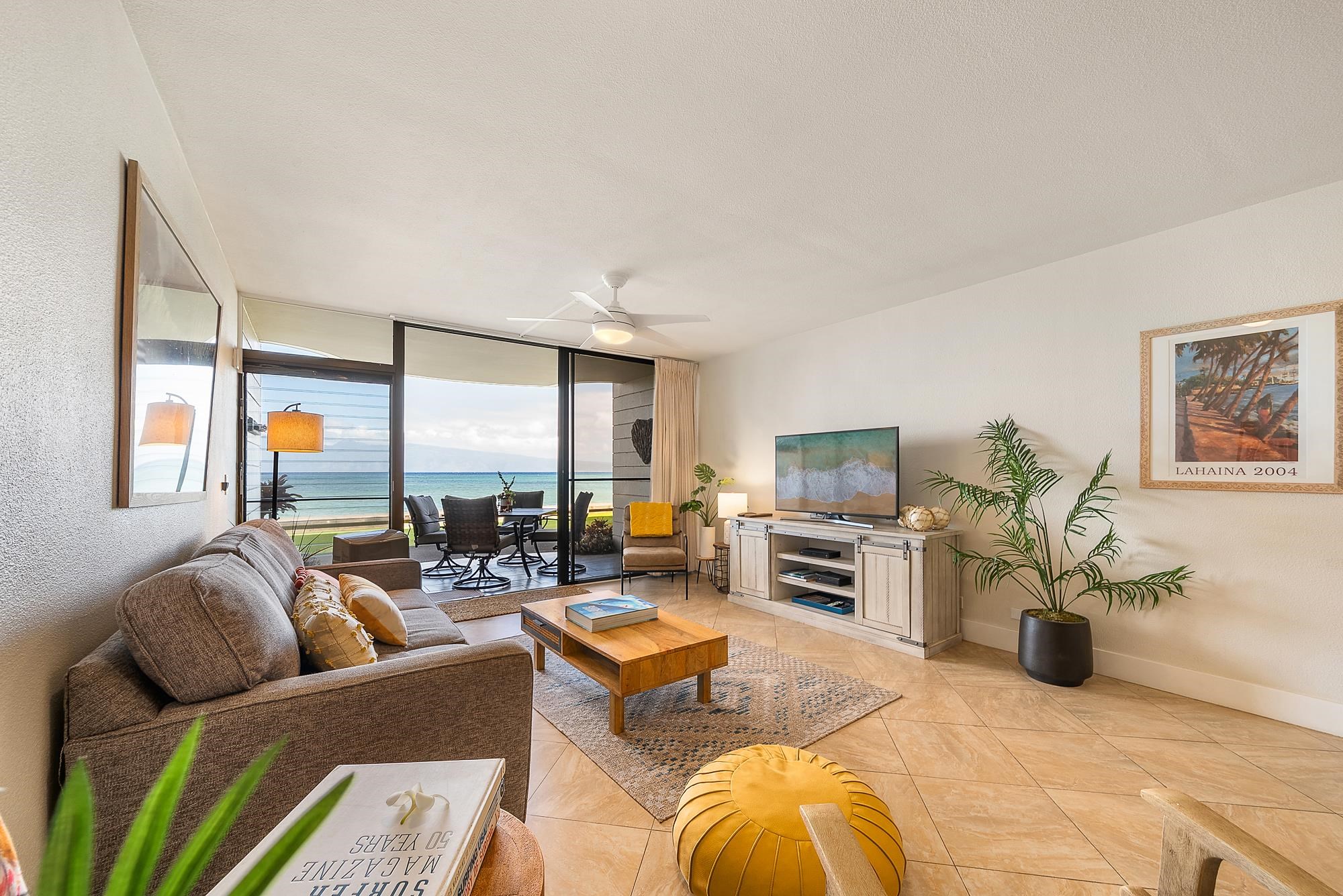 4471 Lower Honoapiilani Road, Unit 118 Lahaina, HI 96761 - Photo 26 of 41 a living room with furniture and a flat screen tv