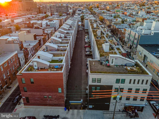 a front view of a building with a swimming pool