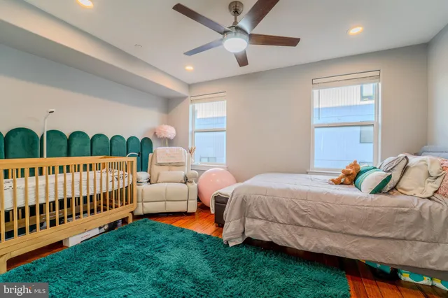 a bedroom with bed and a window