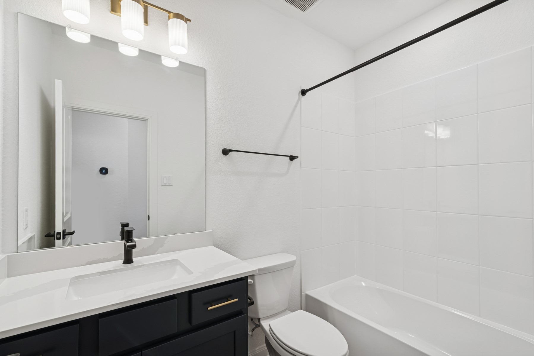 123 Blue River Trail Rosenberg, TX 77471 - Photo 15 of 46 a bathroom with a sink a toilet and shower