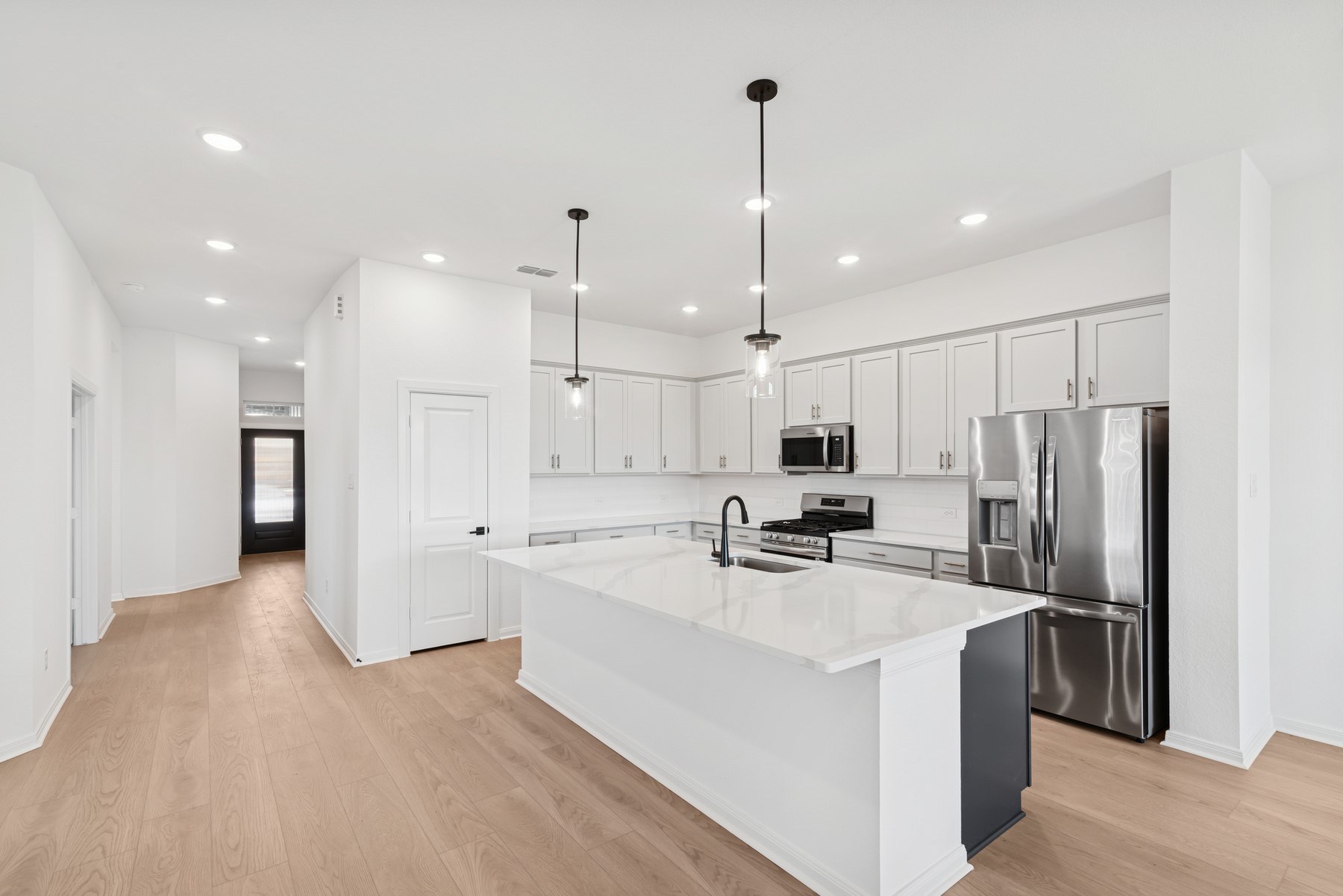 123 Blue River Trail Rosenberg, TX 77471 - Photo 26 of 46 a kitchen with stainless steel appliances a refrigerator a sink dishwasher and a stove