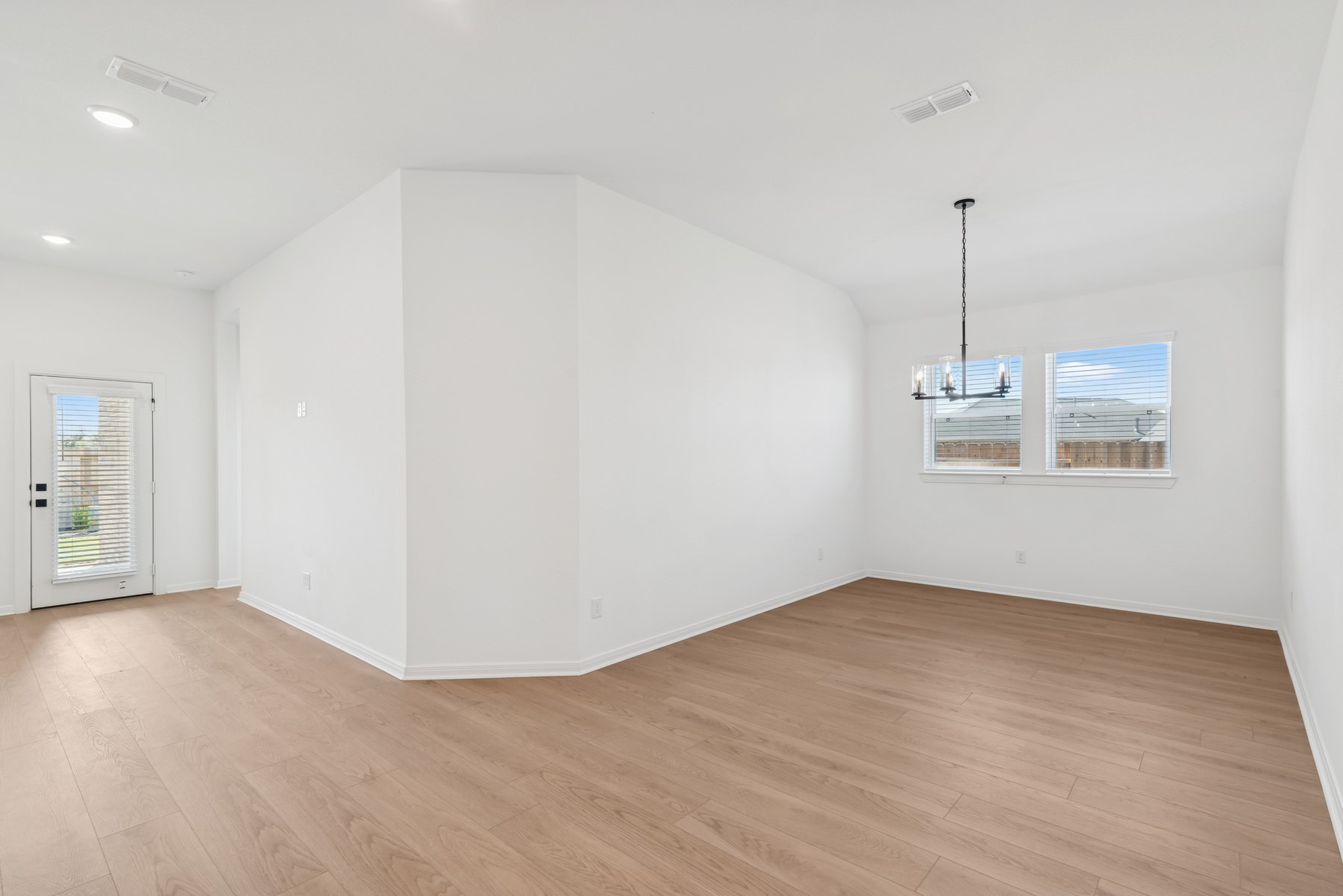 123 Blue River Trail Rosenberg, TX 77471 - Photo 31 of 46 wooden floor in an empty room with a window