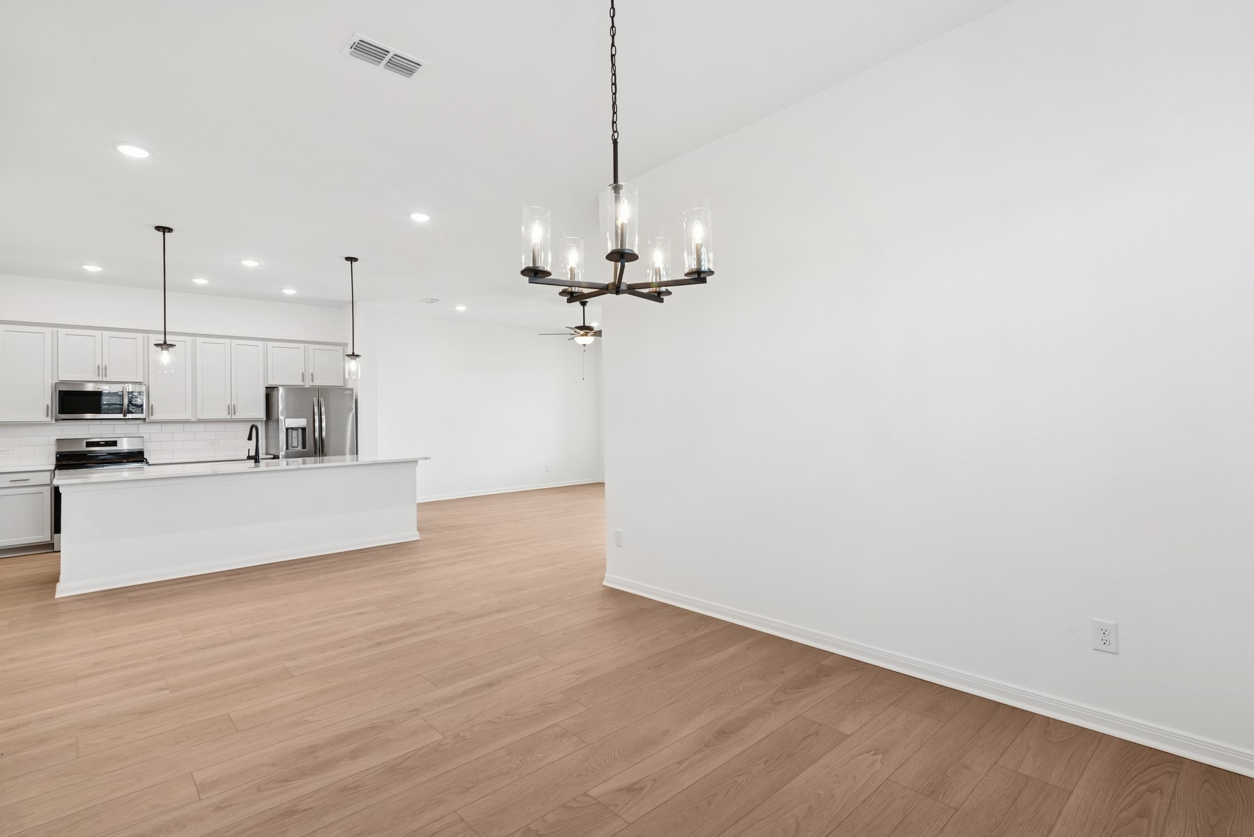 123 Blue River Trail Rosenberg, TX 77471 - Photo 32 of 46 a view of kitchen with refrigerator microwave and stove