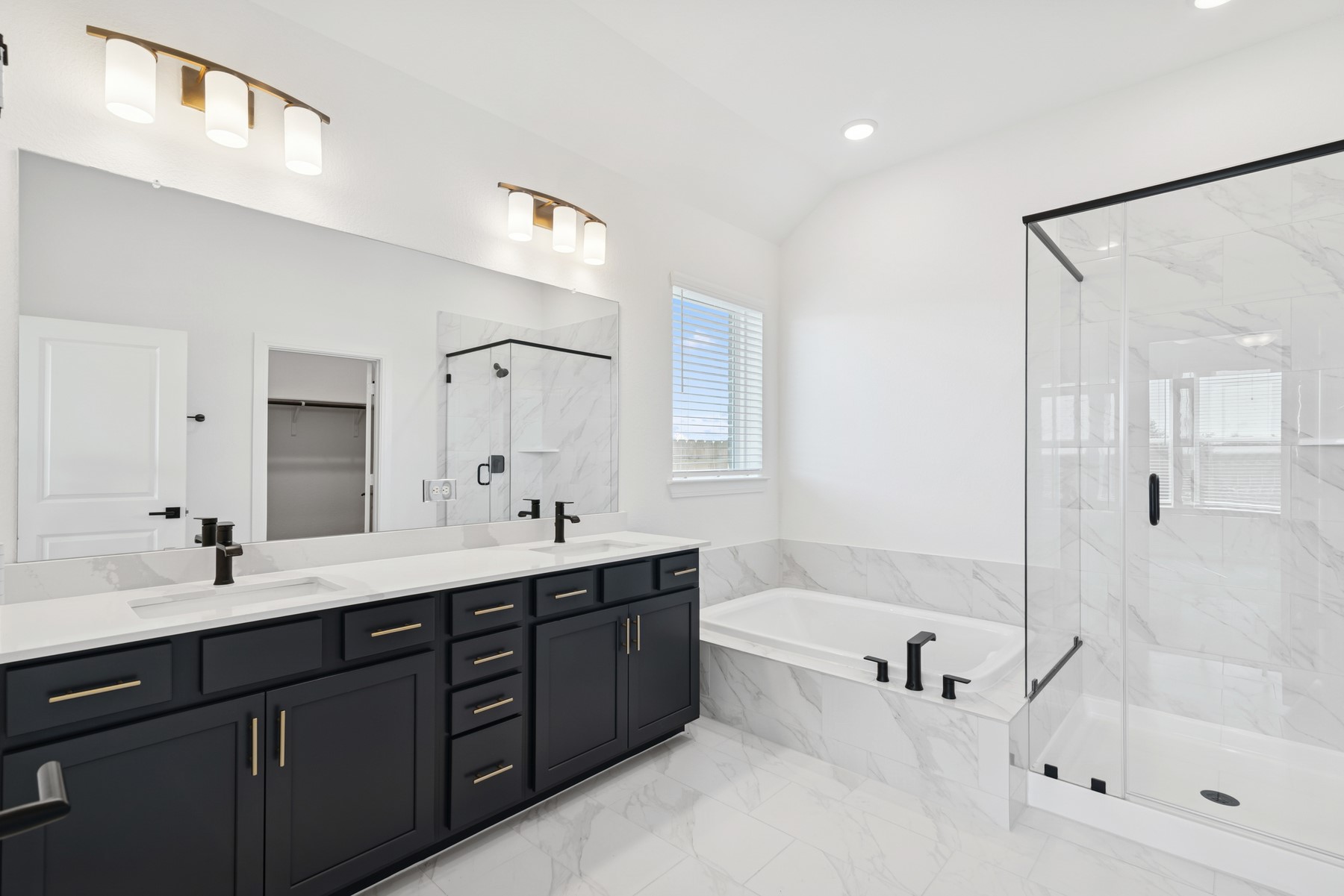 123 Blue River Trail Rosenberg, TX 77471 - Photo 40 of 46 a bathroom with a tub a sink shower and mirror