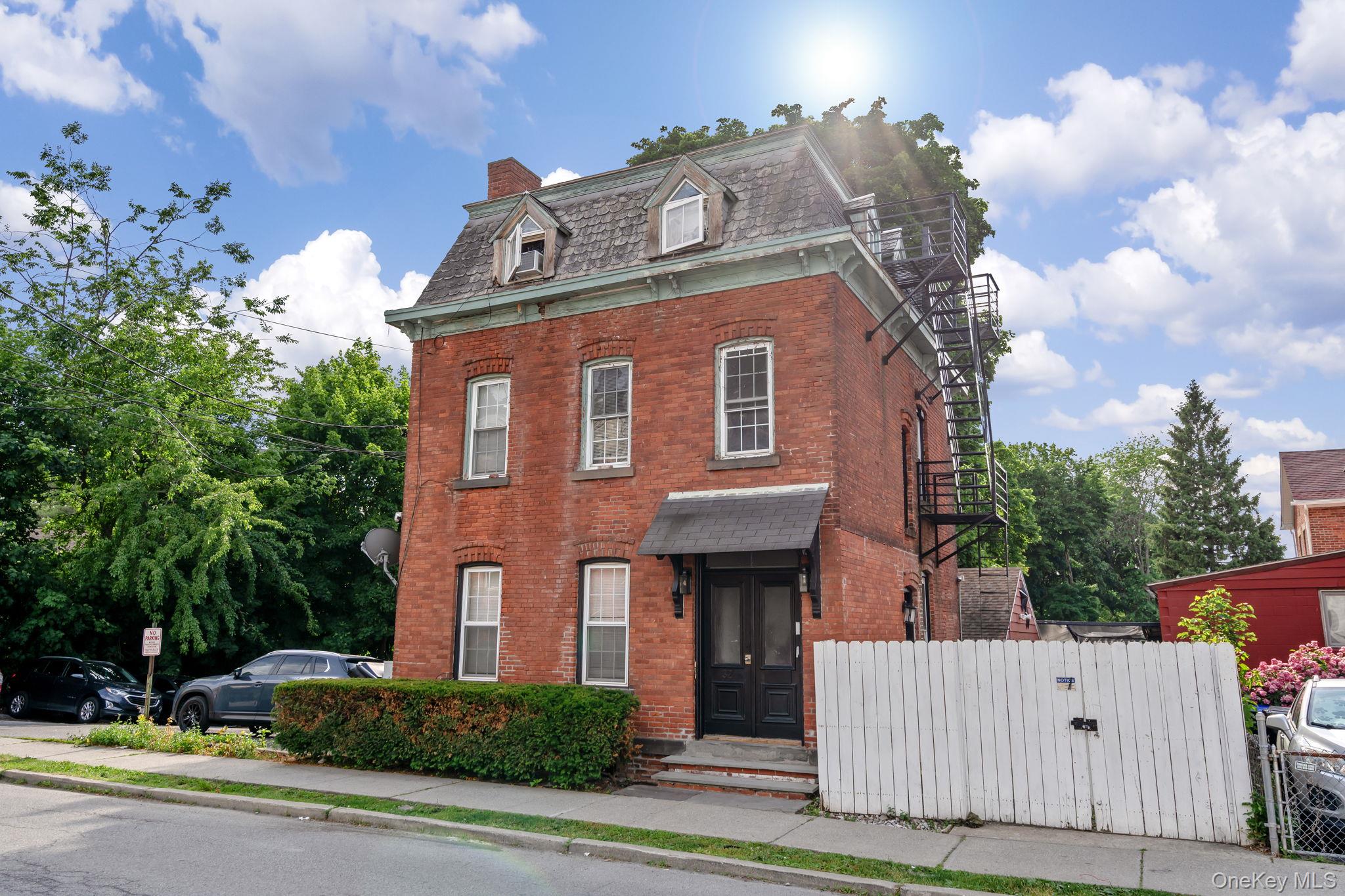 32 North Bridge Street Poughkeepsie, NY 12601 - Photo 1 of 19 a front view of a house with a yard