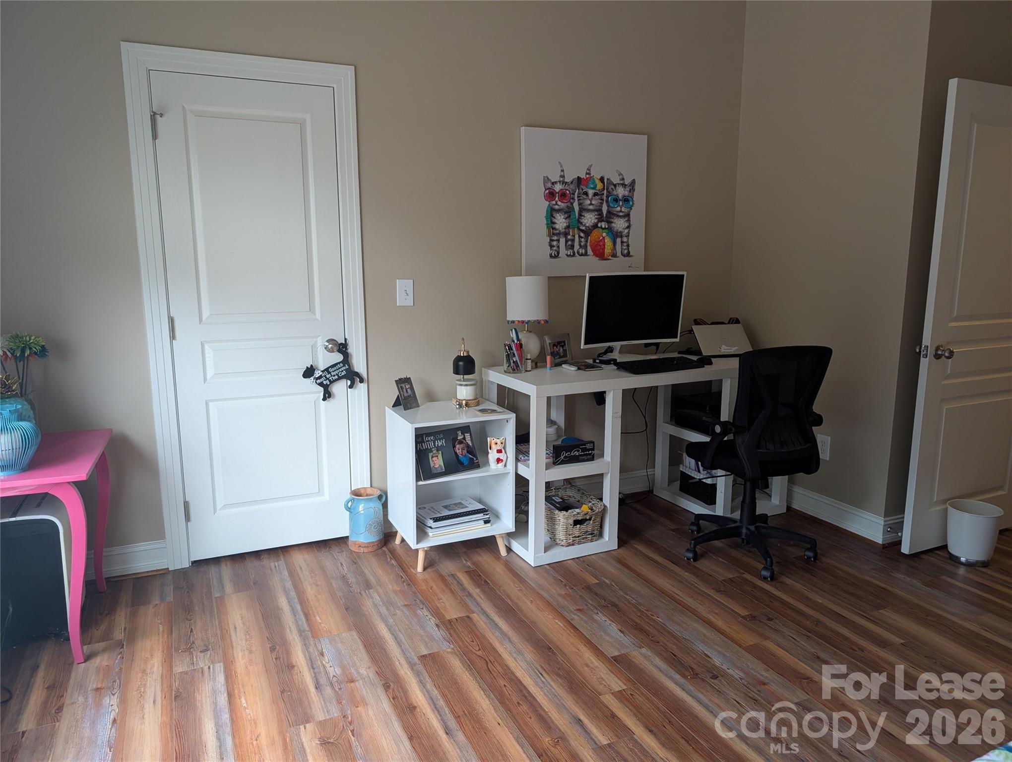 20207 Colony Point Lane Cornelius, NC 28031 - Photo 22 of 26 a view of a workspace with furniture and wooden floor