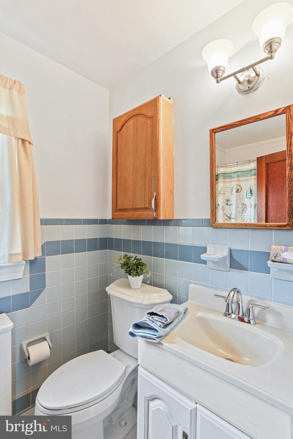 1218 Leeds Terrace Halethorpe, MD 21227 - Photo 21 of 31 Oak storage cabinet in hall bath